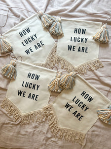 'How Lucky We Are' Banner