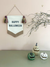 Load image into Gallery viewer, Decorative Halloween banner with tassels, pumpkins, and a branch on a neutral background
